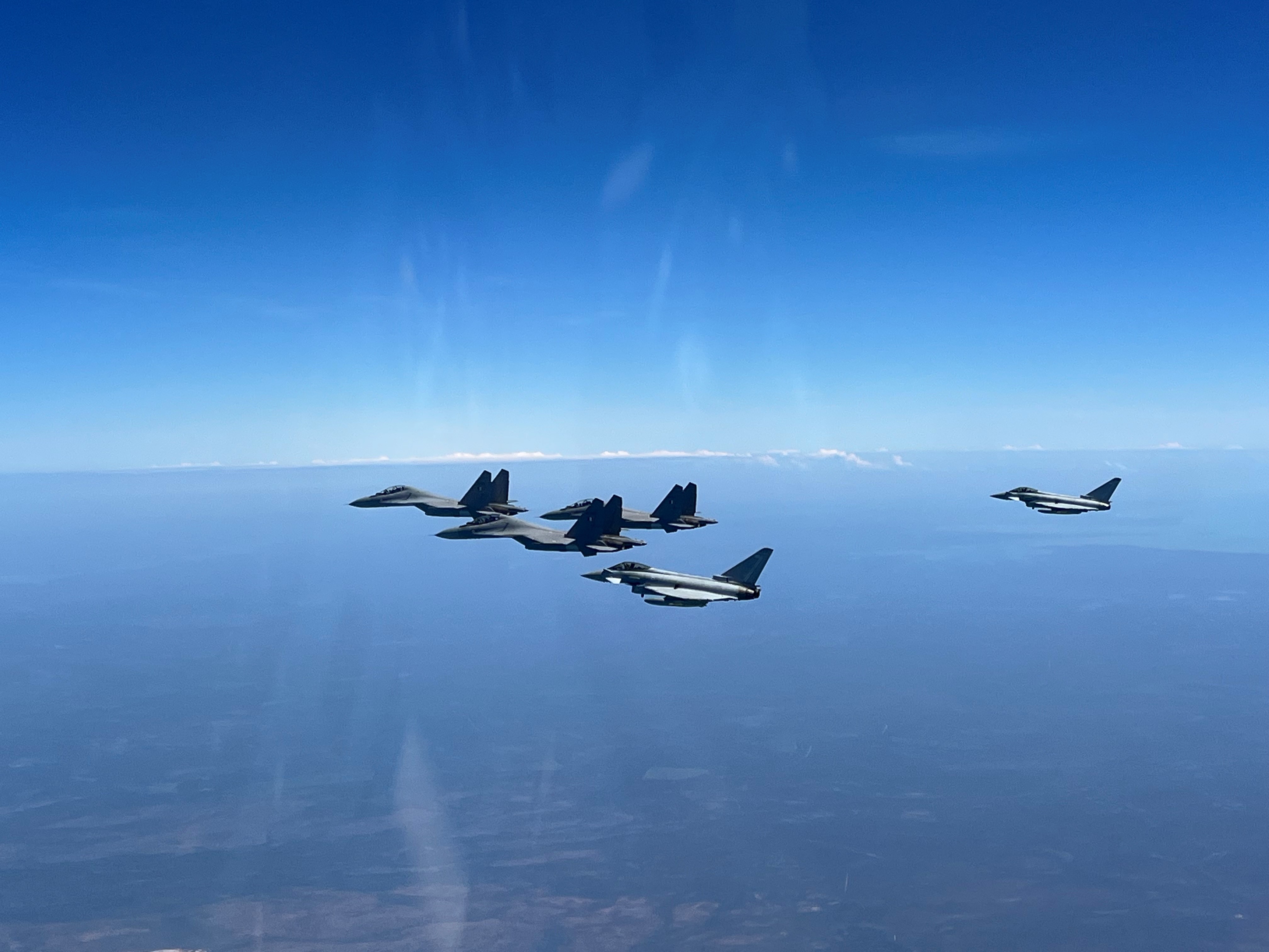 Image shows RAF Typhoons in formation as they fly.